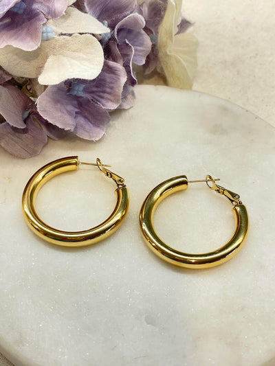 Large solid gold hoop earrings